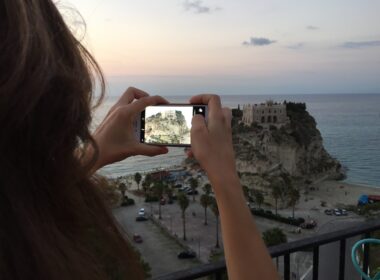 girl takes photo on smartphone